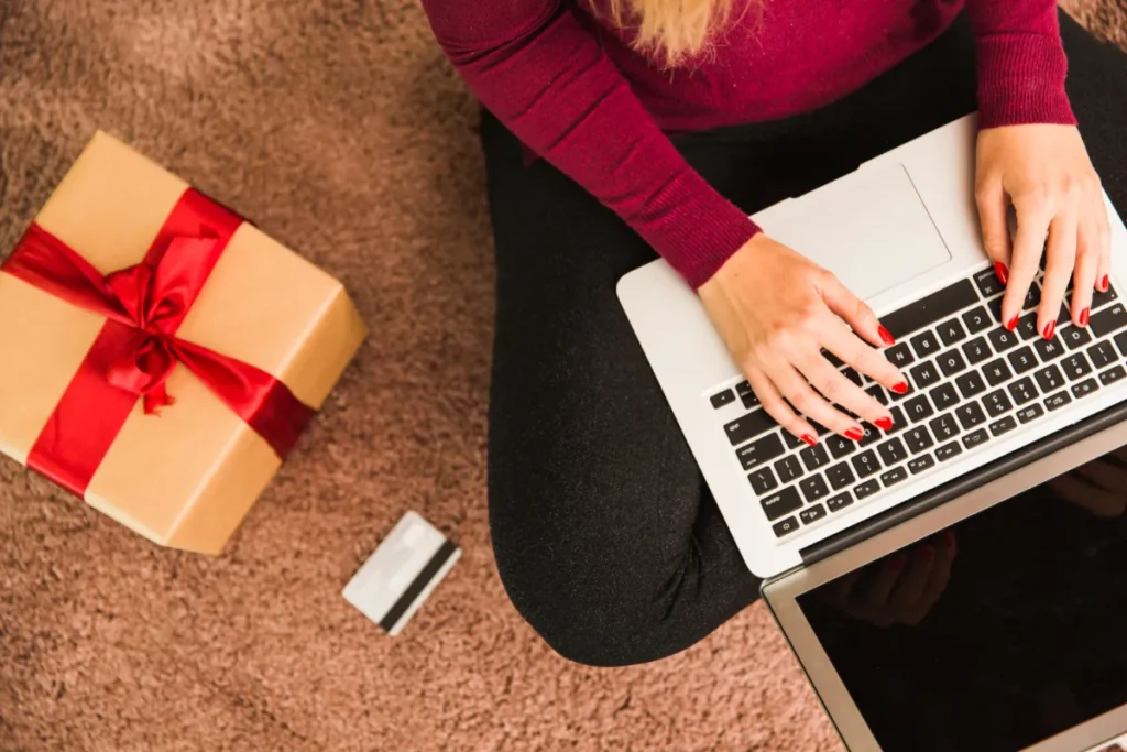 woman shopping for Christmas on her laptop