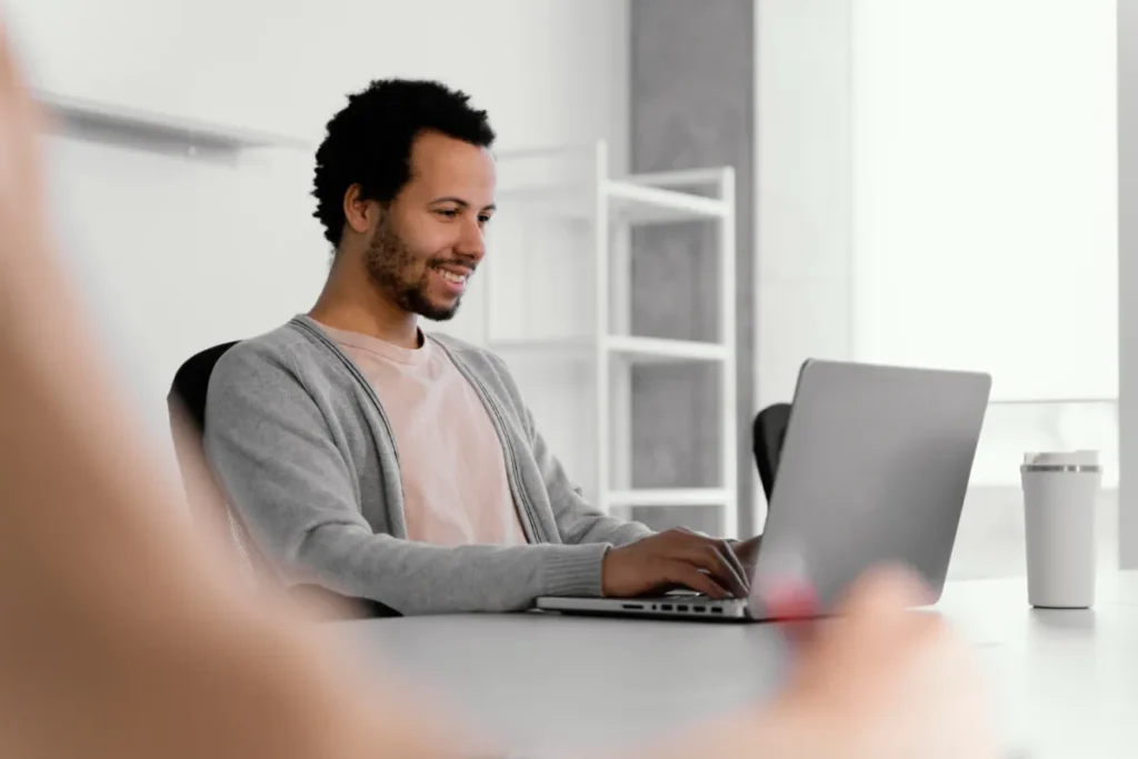 man sitting at computer engage in email that was sent to him