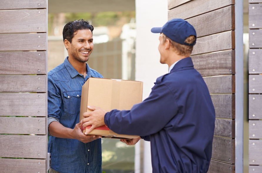 delivery-person-handing-over-a-package-to-man