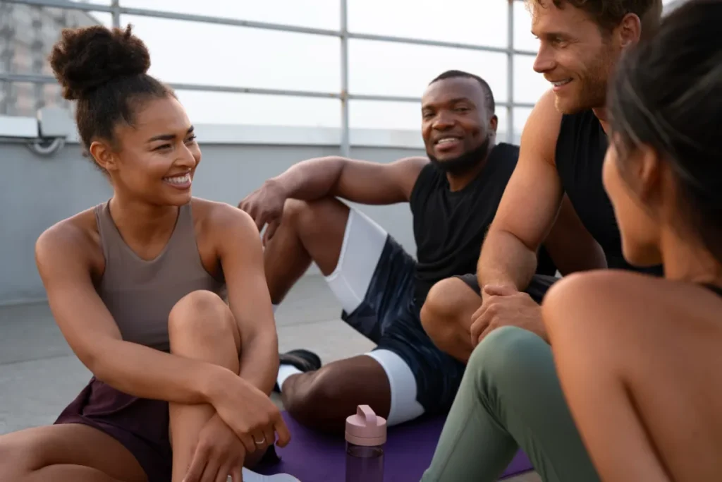 fitness people sitting outside talking