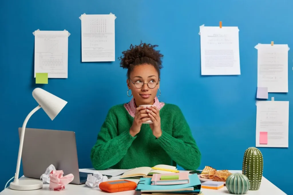 check grammar in your email. Woman sitting at computer wondering if her grammar is right