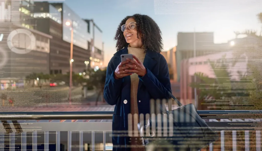 Young hip girl, standing with iPhone in front of city and future overlays in front of her that are blurred out for the future of email marketing trends