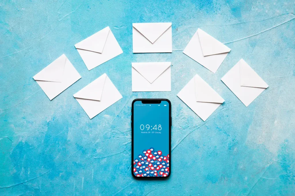 email marketing why it still works phone on the table with envelopes